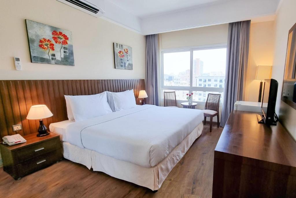 Katil atau katil-katil dalam bilik di Ramada by Wyndham Beach Hotel Ajman