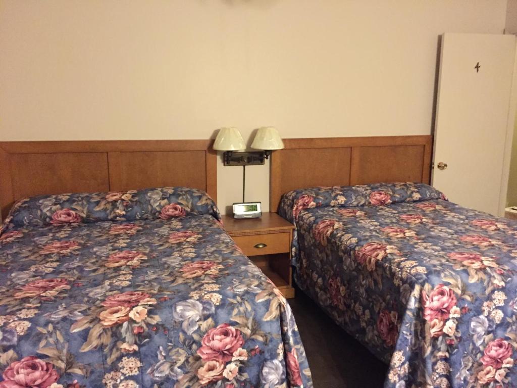 Postel nebo postele na pokoji v ubytování Hotel Motel Arnold