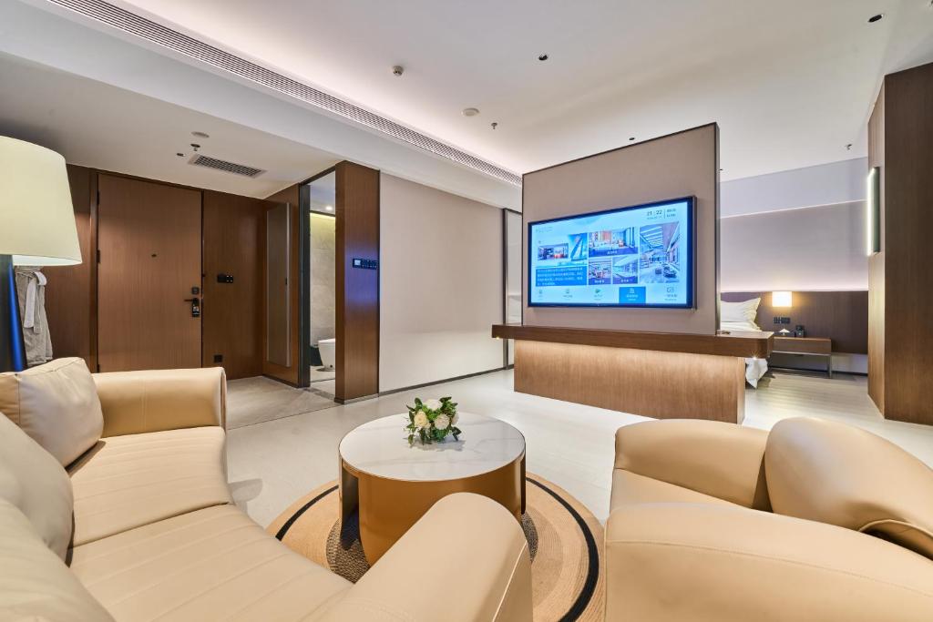 TV a/nebo společenská místnost v ubytování Beijing Suiyu Hotel