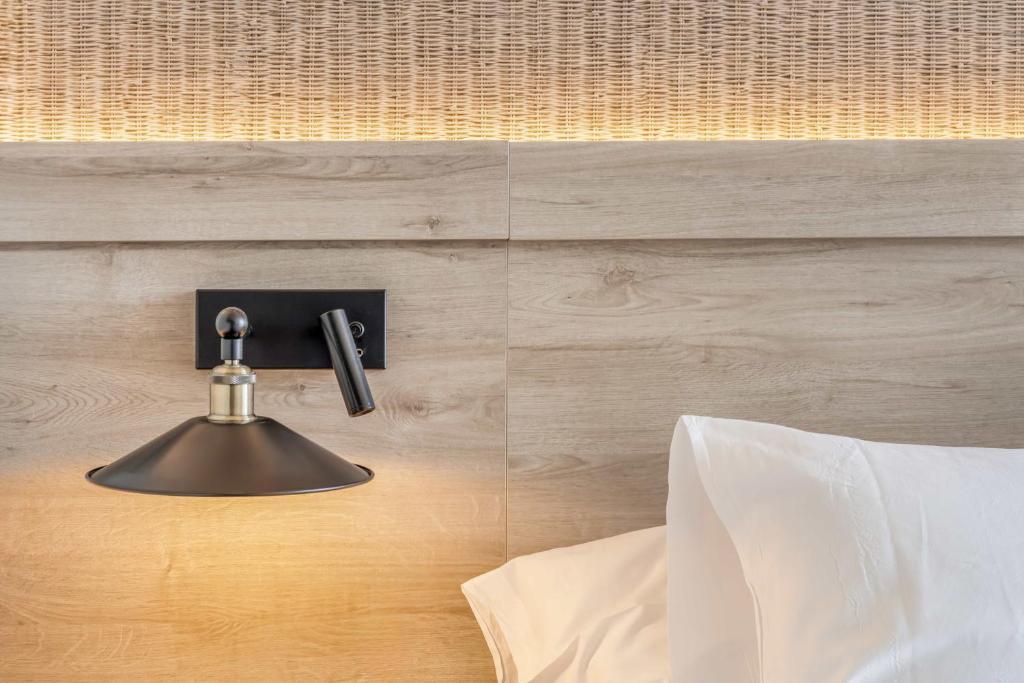 Postel nebo postele na pokoji v ubytování Hotel Metropol