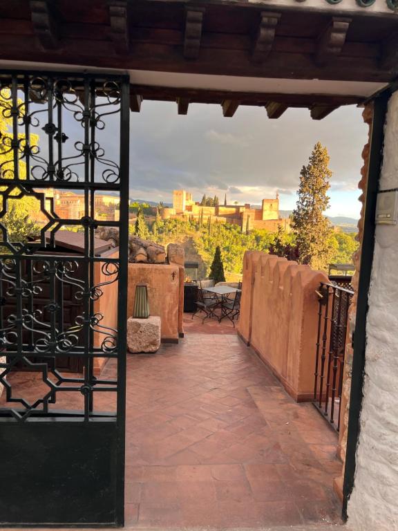 an open door to a patio with a view at La Casa JuanRanas in Granada