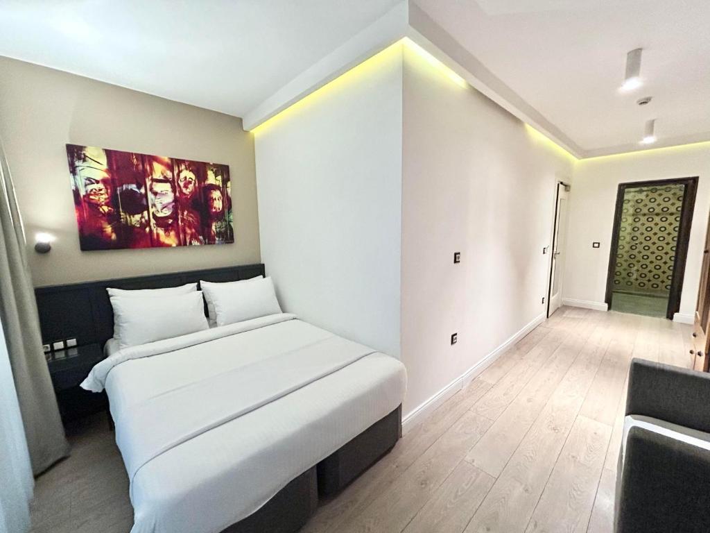 Postel nebo postele na pokoji v ubytování Fitas Oda Hotel