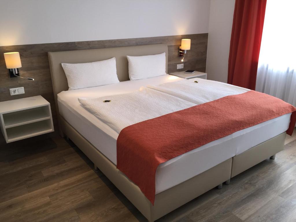 Postel nebo postele na pokoji v ubytování Pension Haus Erika