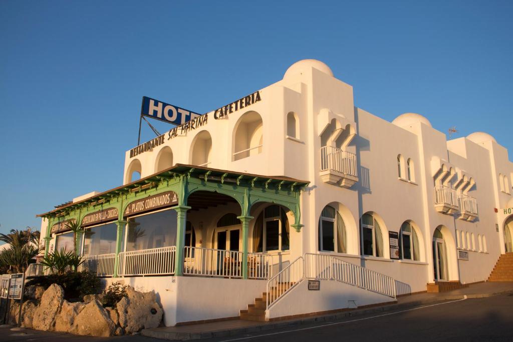 a building with a hotel on top of it at Hotel Sal Marina in Mojácar