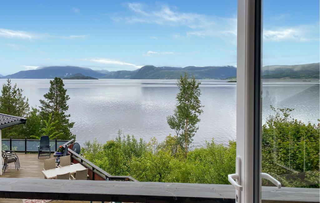 a view of a lake from a house at 1 Bedroom Amazing Home In Tingvoll in Tingvoll