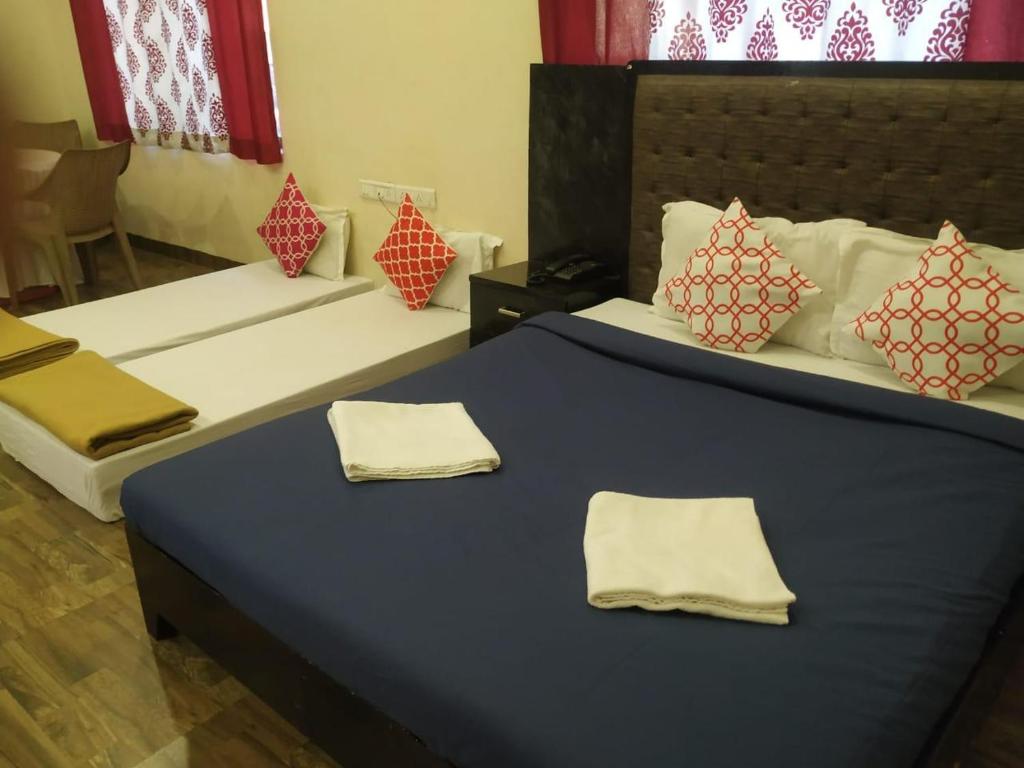Postel nebo postele na pokoji v ubytování Suite Rooms at Mandwa