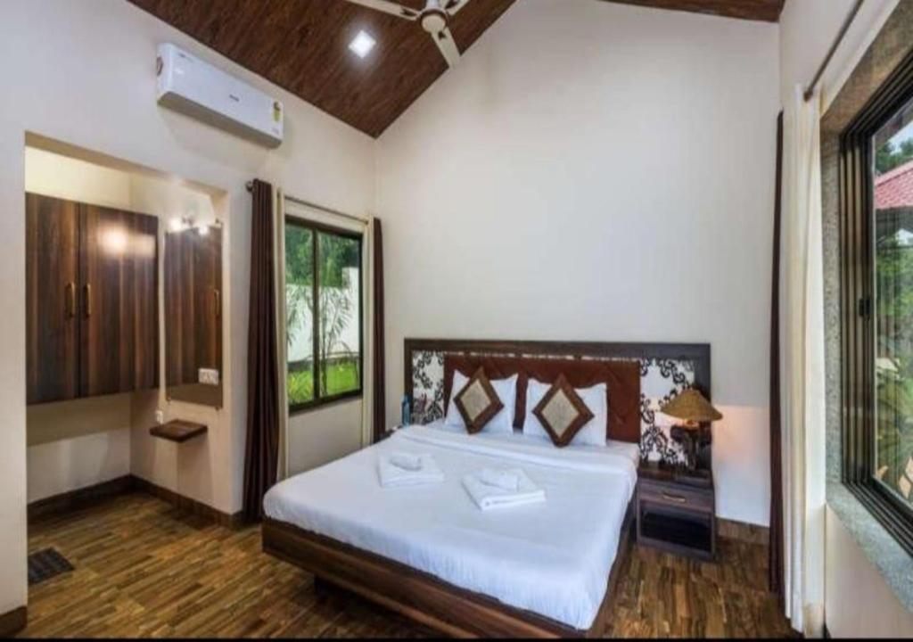 Postel nebo postele na pokoji v ubytování Suite Rooms at Mandwa