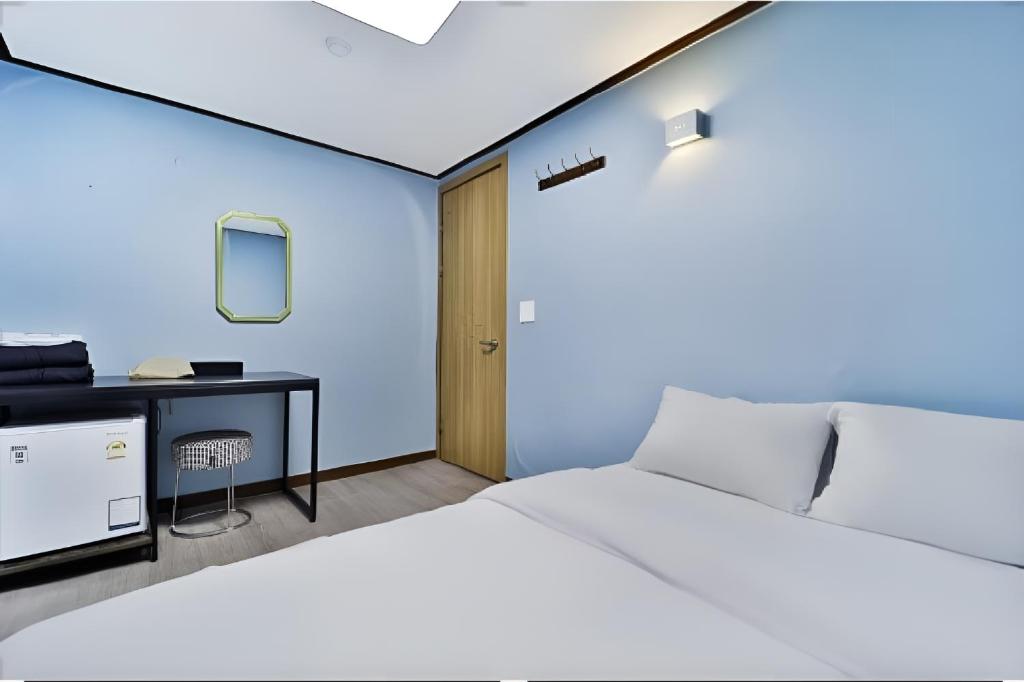 En eller flere senge i et værelse på stayaroma