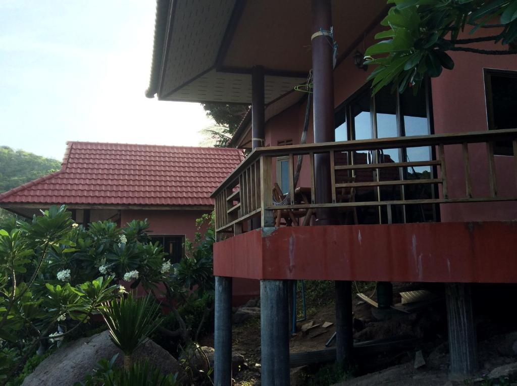 a house with a red deck in front of it at Aow Leuk Grand Hill in Ko Tao
