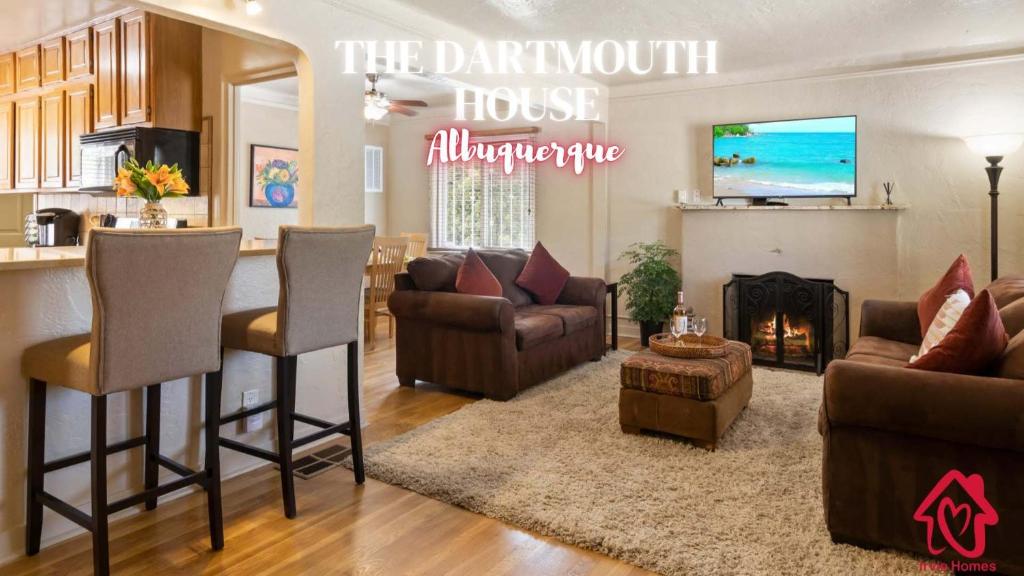 a living room with a couch and chairs and a fireplace at The Dartmouth House in Albuquerque