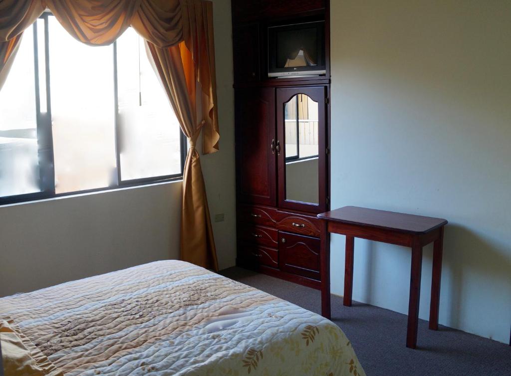 Postel nebo postele na pokoji v ubytování Hostal Pucará