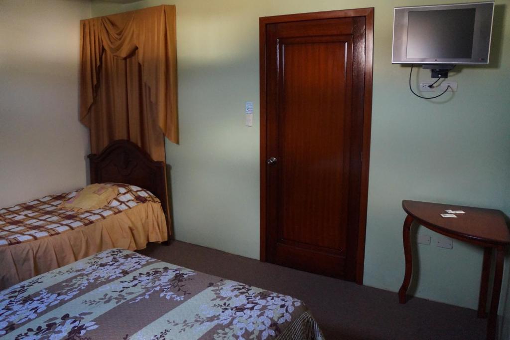 Postel nebo postele na pokoji v ubytování Hostal Pucará