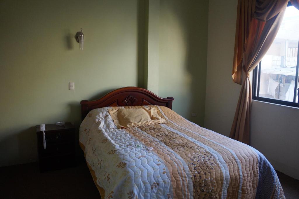 Postel nebo postele na pokoji v ubytování Hostal Pucará