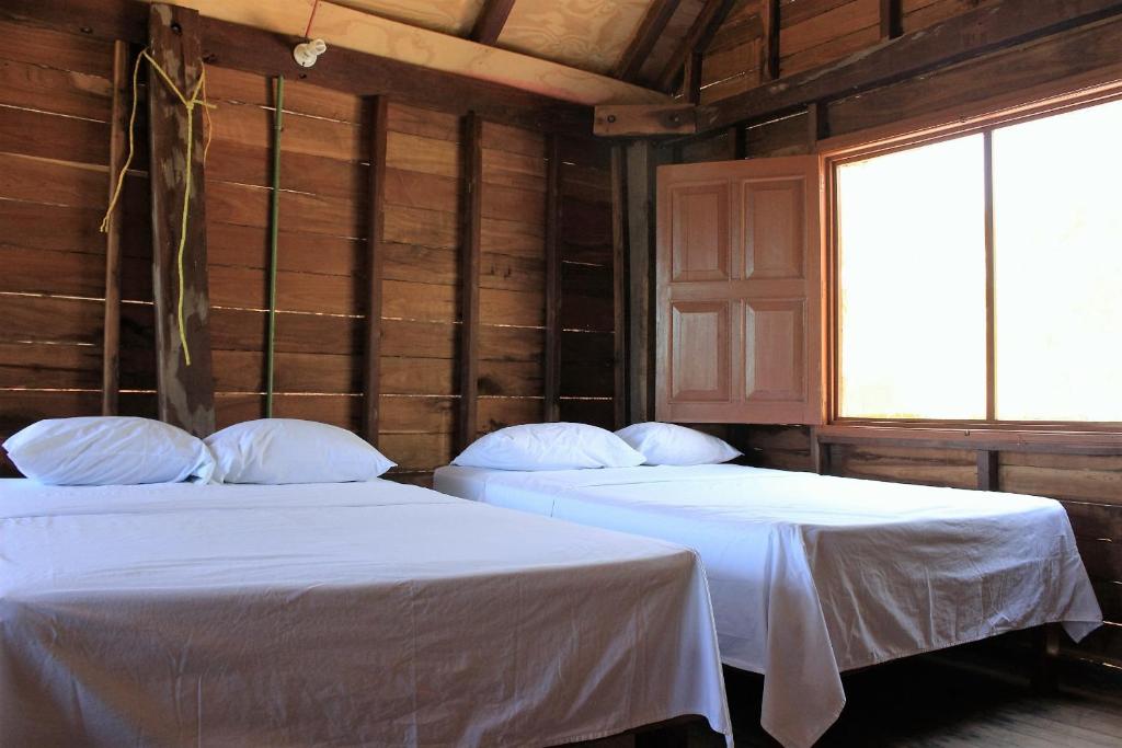 Postel nebo postele na pokoji v ubytování Cabañas El Cuyo