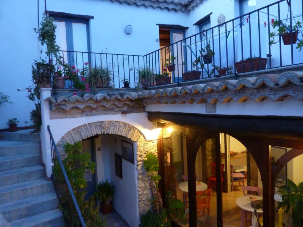 an external view of a building with stairs and plants at B&B Amphisya in Roccella Ionica