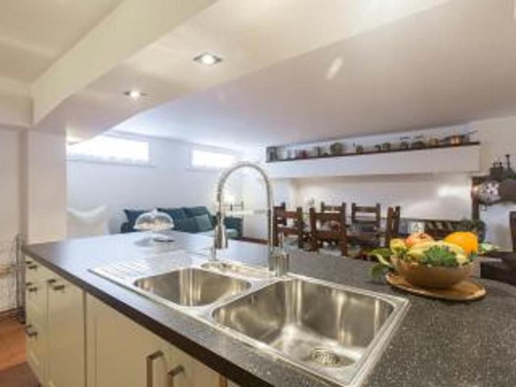 a kitchen with a sink and a counter top at L'appartamento di Monica in Casal Palocco