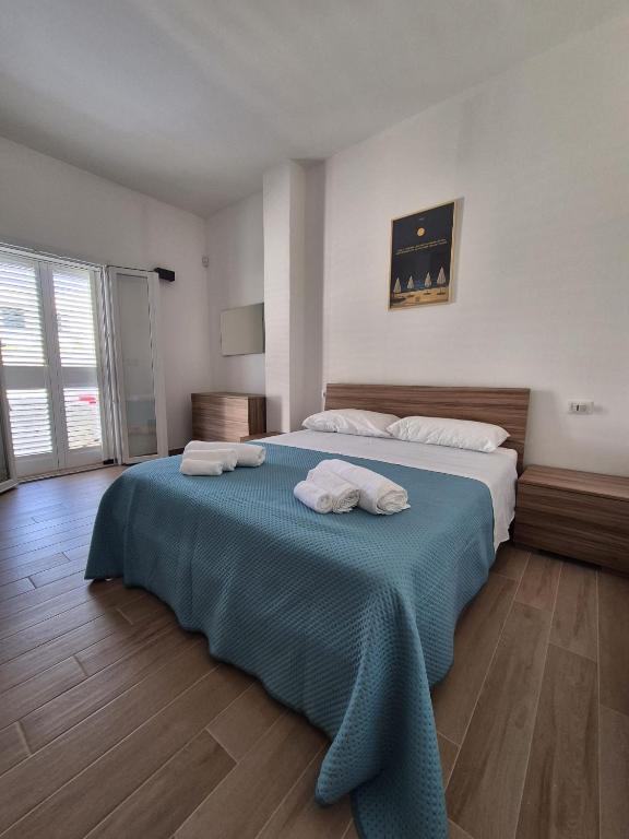 En eller flere senge i et værelse på Casa Picci Appartamento Sun Gallipoli