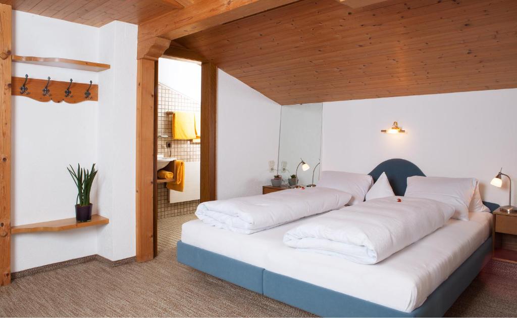 Postel nebo postele na pokoji v ubytování Haus Arnika