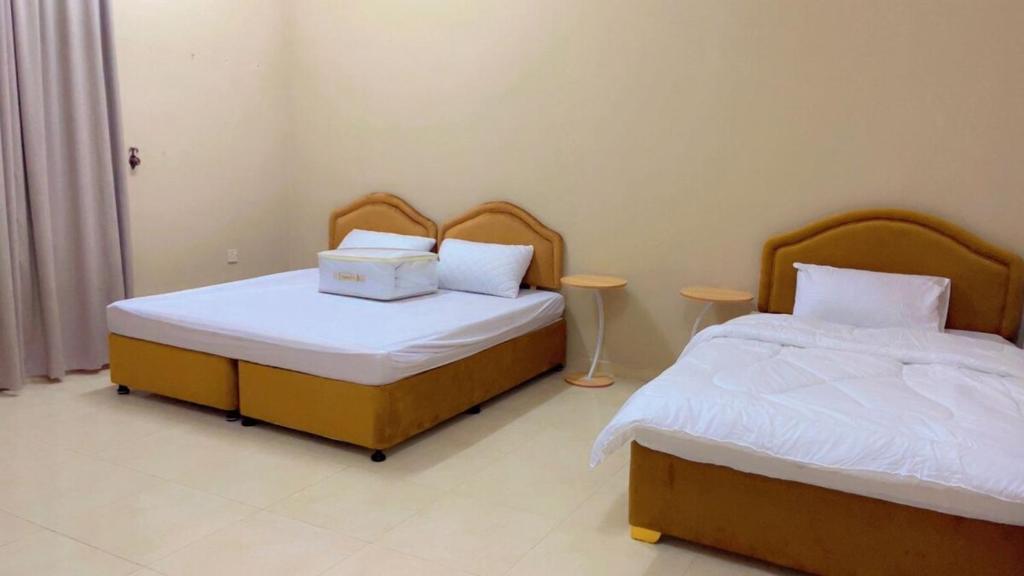 Postel nebo postele na pokoji v ubytování شقة رهف الجنوب