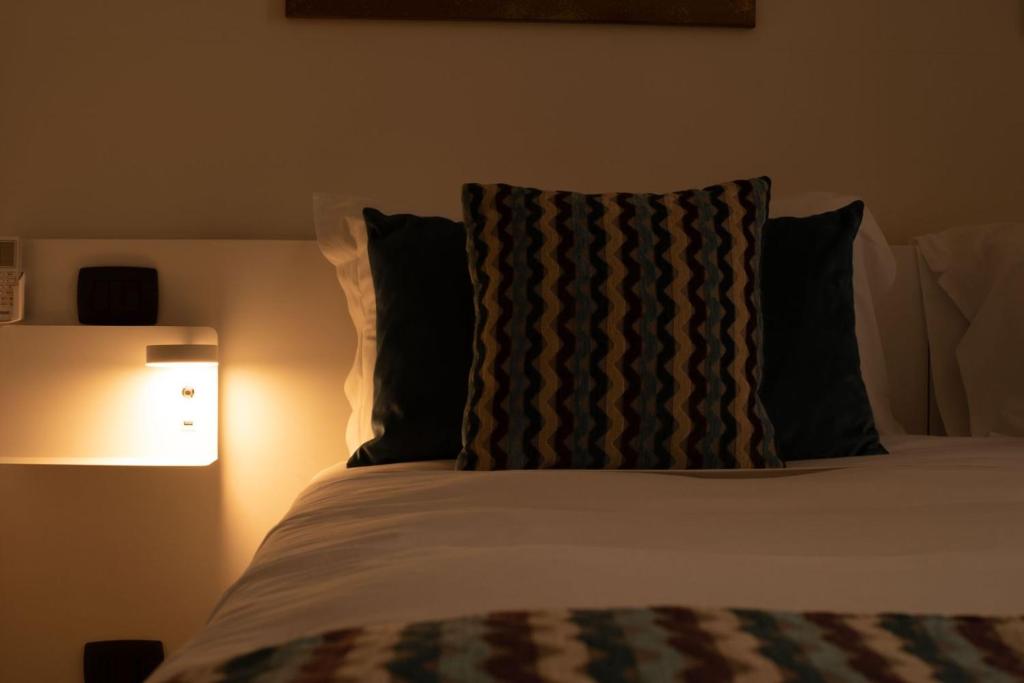 Postel nebo postele na pokoji v ubytování Archimede Vacanze B&B