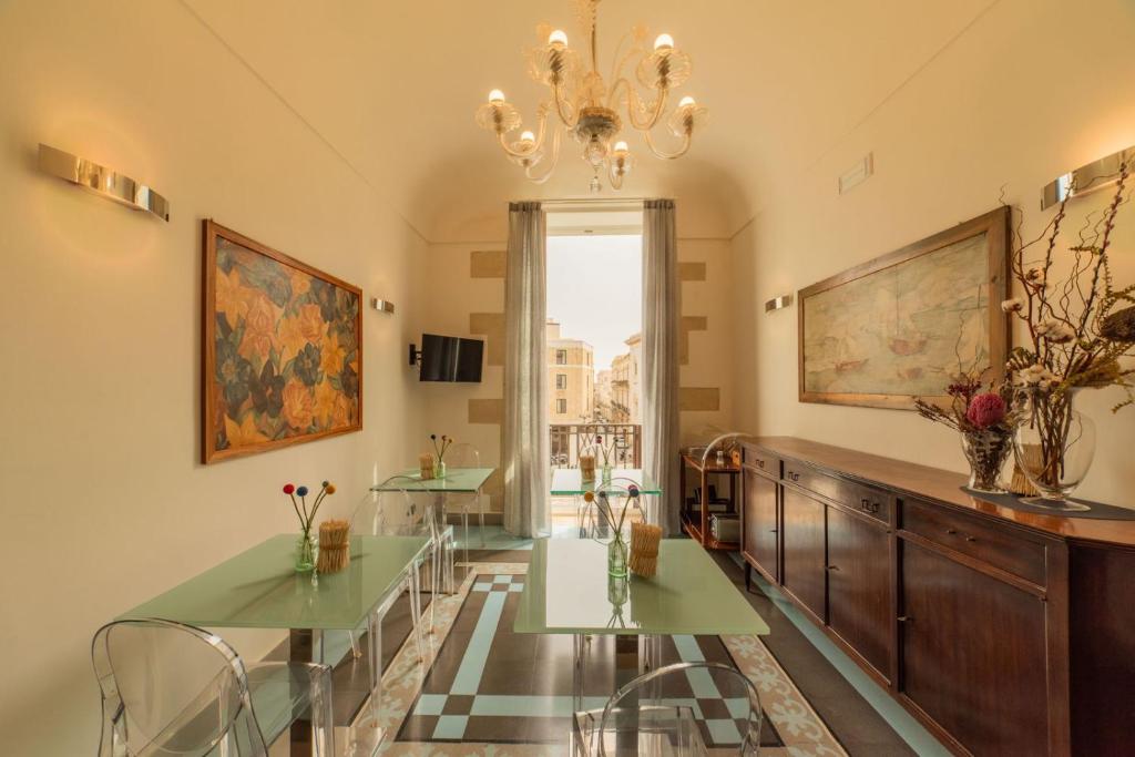 TV a/nebo společenská místnost v ubytování Archimede Vacanze B&B