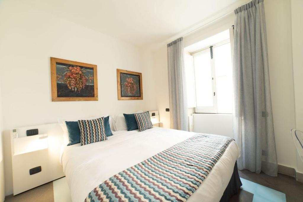 Postel nebo postele na pokoji v ubytování Archimede Vacanze B&B