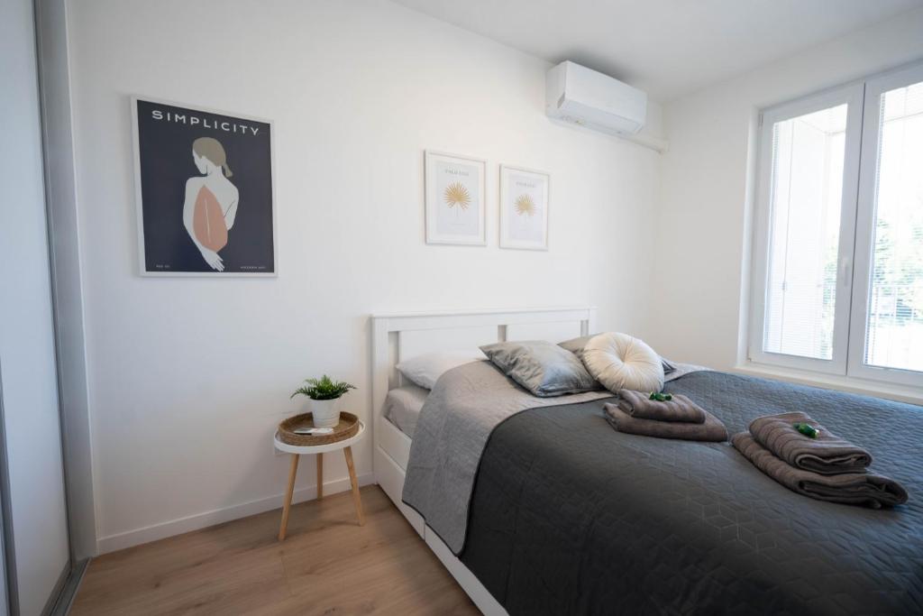 Postel nebo postele na pokoji v ubytování Apartment Centrum-VUSCH parking included