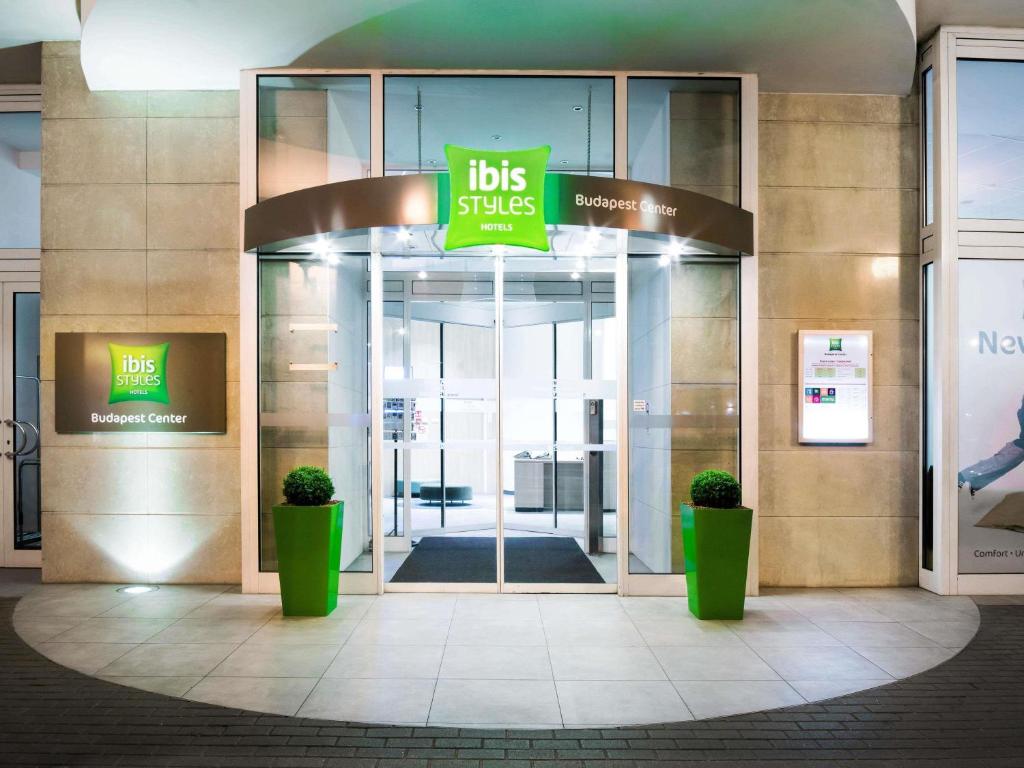 a building with a sign that says kids sales at Ibis Styles Budapest Center in Budapest