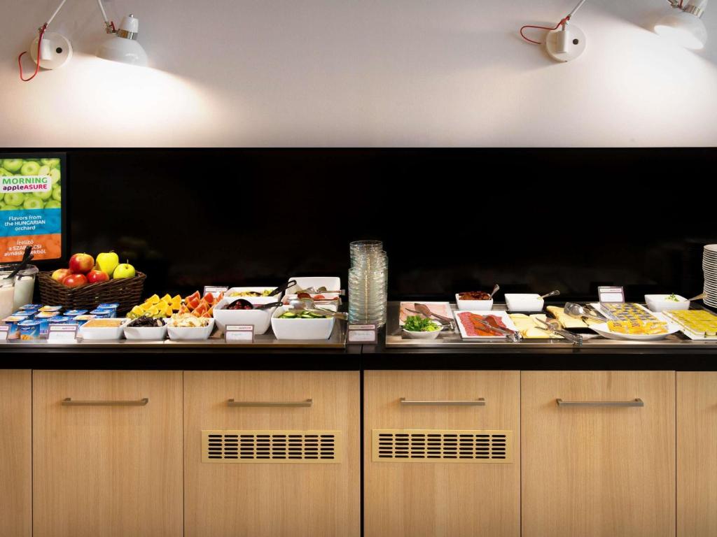 a buffet line with many different types of food at Ibis Styles Budapest Center in Budapest