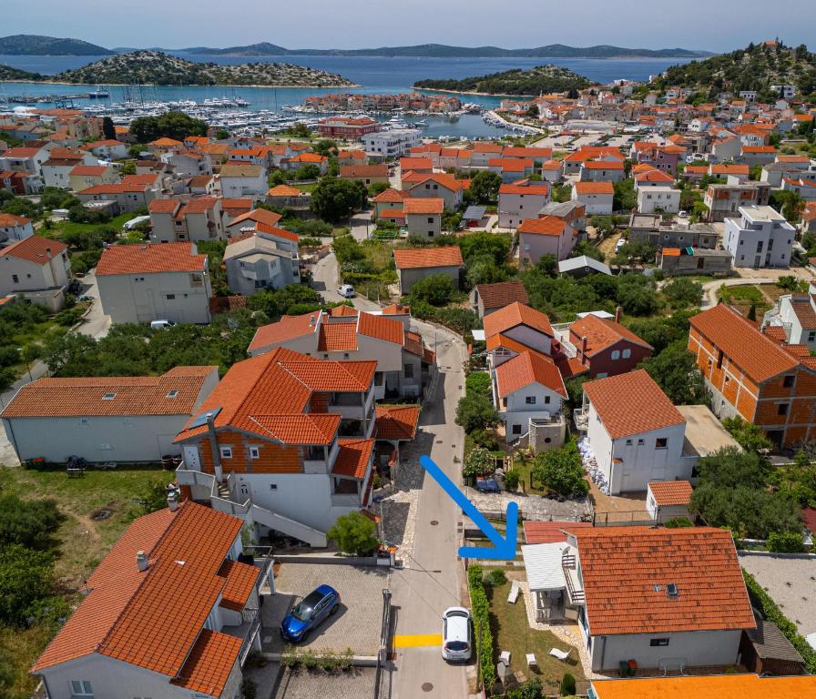 an aerial view of a town with orange roofs at Apartmani Simona Tribunj in Tribunj