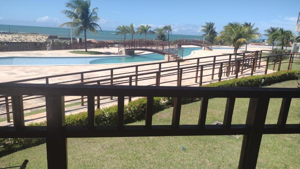 a view from a balcony of a pool and a bridge at Golden Dunas 123B in Extremóz