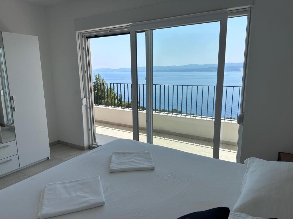 Postel nebo postele na pokoji v ubytování Elona Apartments