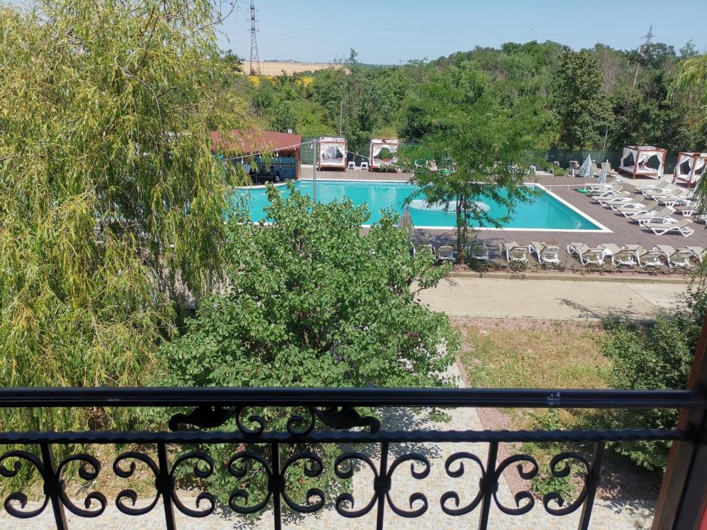 a view of a pool from a balcony at For Fun resort naturist libertin - adults only in Costinesti