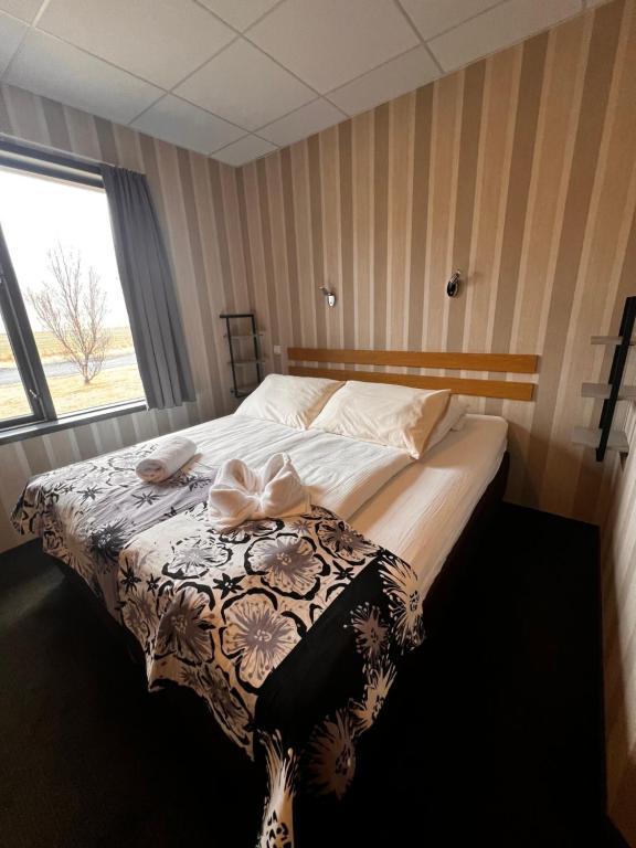 Rúm í herbergi á Hótel Skógafoss by EJ Hotels