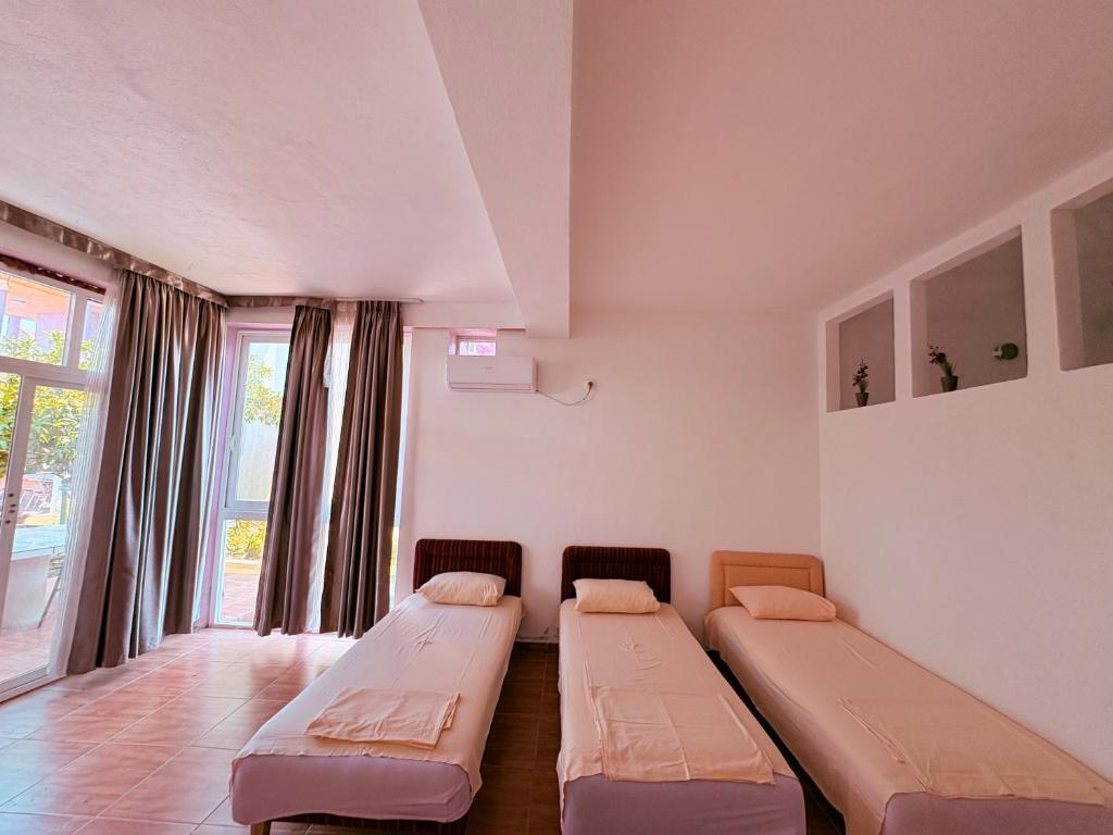 Letto o letti in una camera di Shkreli Apartments