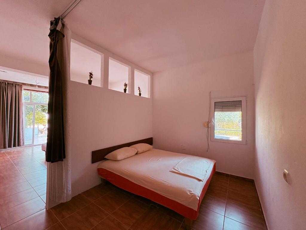 Letto o letti in una camera di Shkreli Apartments