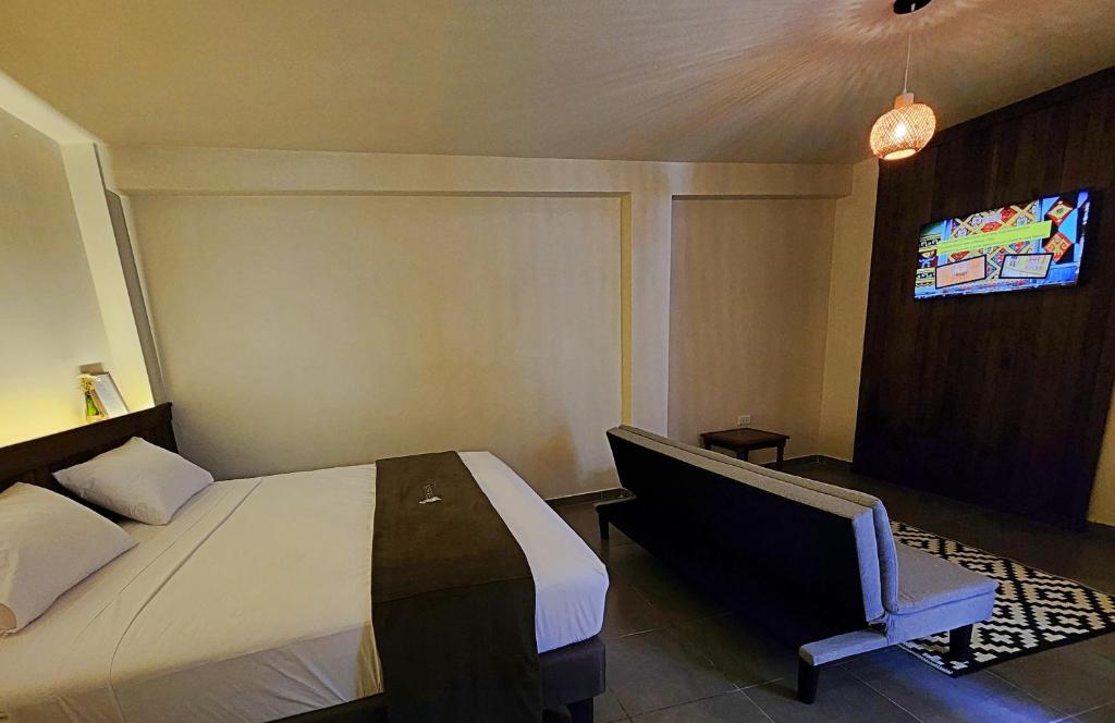Postel nebo postele na pokoji v ubytování China Chancay Hotel