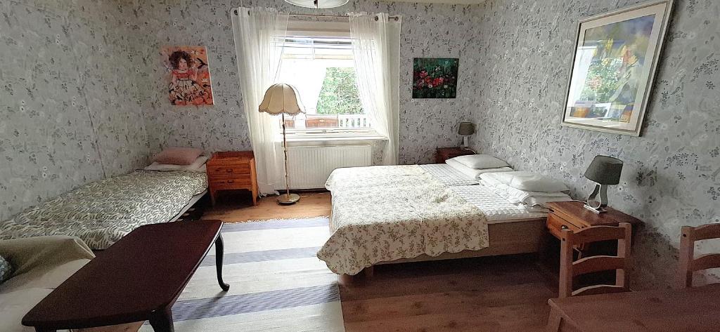 Postel nebo postele na pokoji v ubytování Hus Sjögläntan