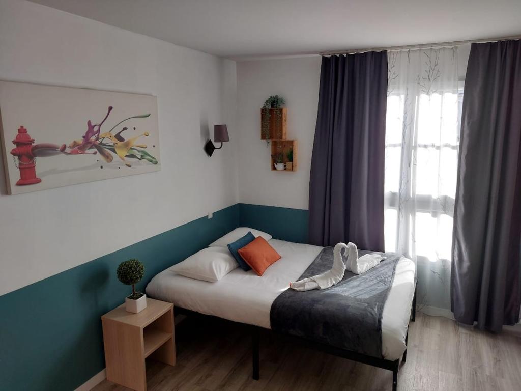 Ένα ή περισσότερα κρεβάτια σε δωμάτιο στο Your lovely flat in Disneyland !