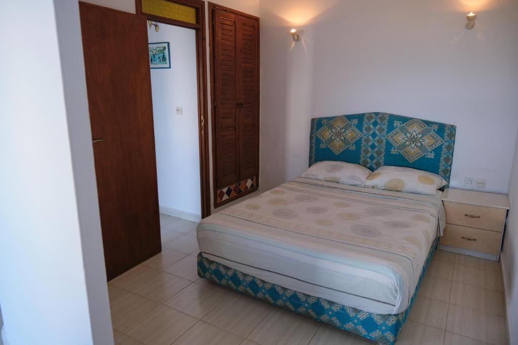 Postel nebo postele na pokoji v ubytování Appart Hôtel La Planque