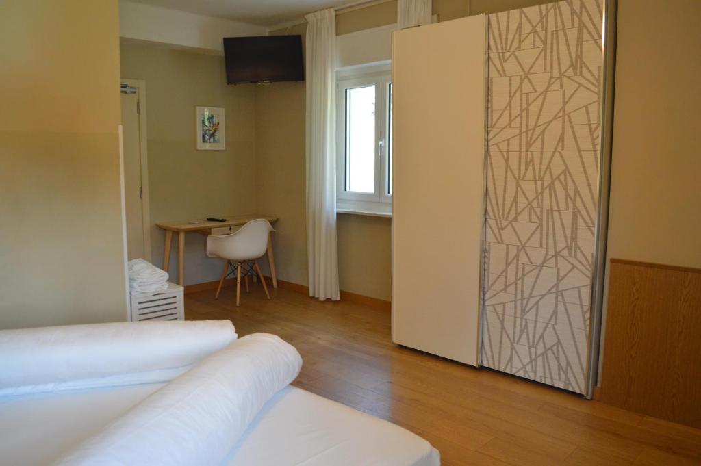 Postel nebo postele na pokoji v ubytování Park Hotel Sancelso