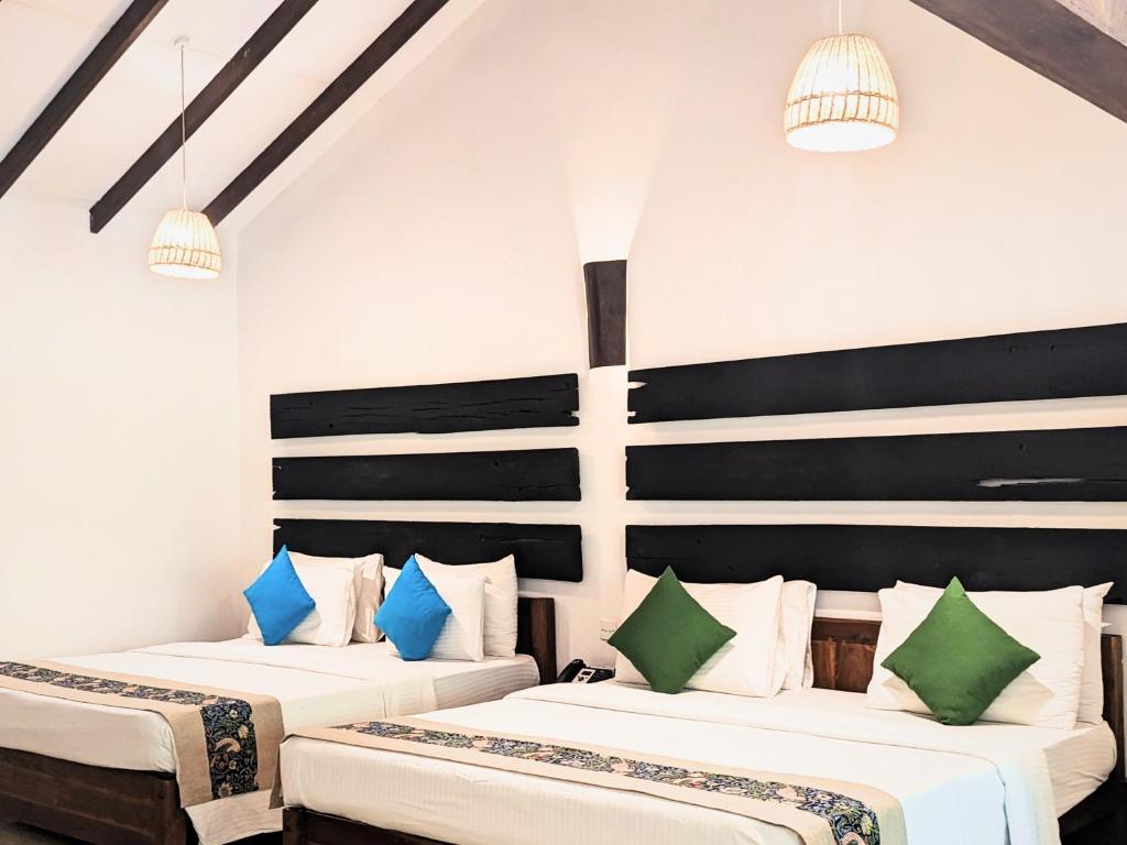 Postel nebo postele na pokoji v ubytování Pinthaliya Resort