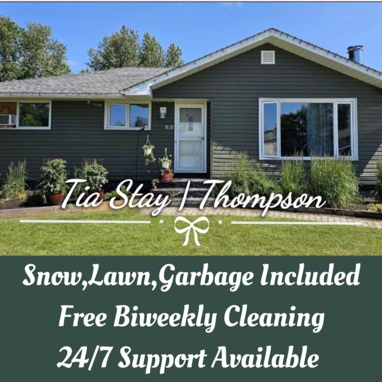 a house with a sign that says tin stay i rh improvement fire lawn salvagealling at Fully Furnished, Contractor-friendly,4Beds, Free Parking&Laundry, Corporate Housing in Thompson
