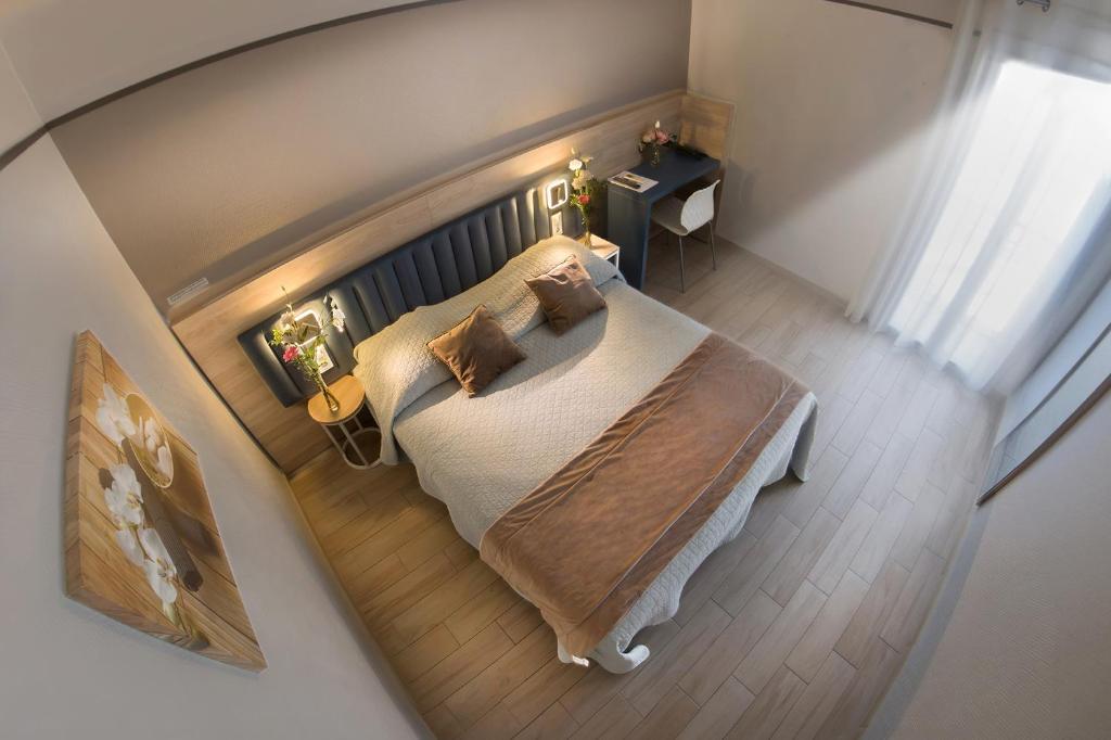 Postel nebo postele na pokoji v ubytování Hotel Le Golfe