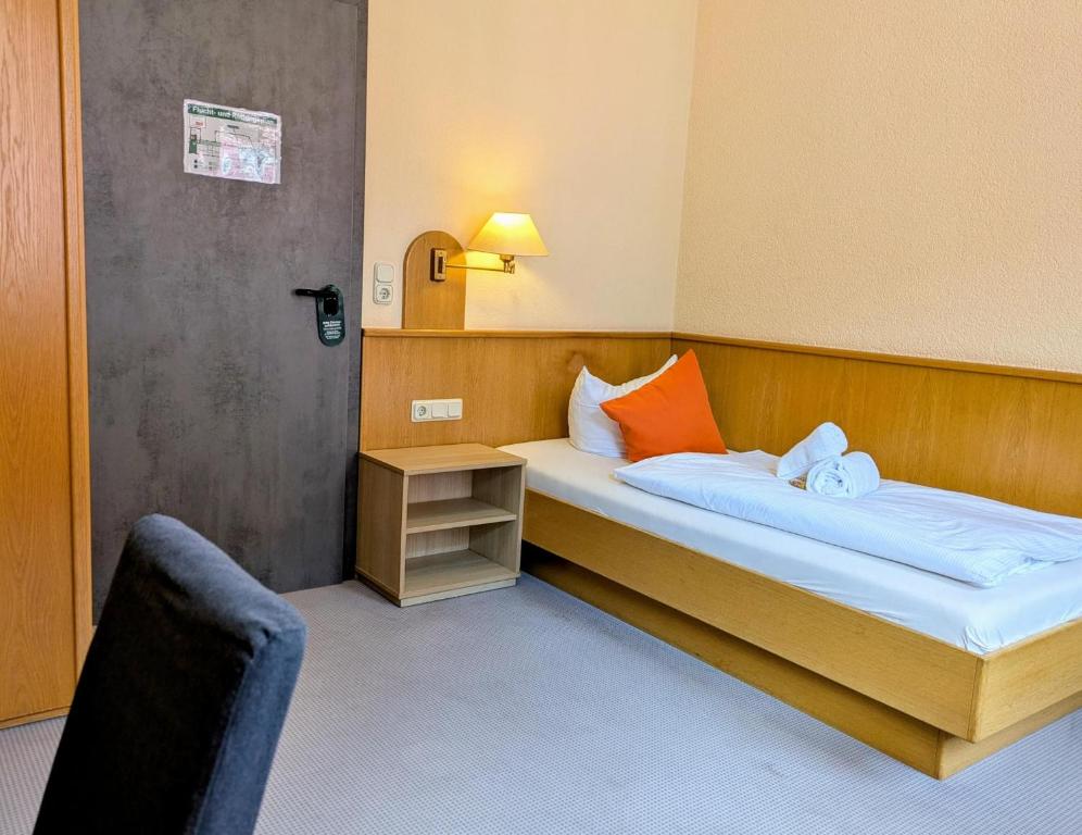 Postel nebo postele na pokoji v ubytování Hotel Walzwerk