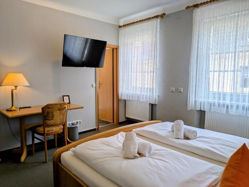 Postel nebo postele na pokoji v ubytování Hotel Walzwerk