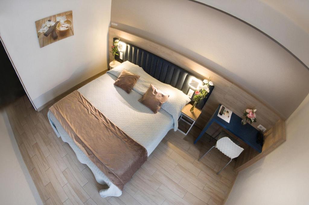 Postel nebo postele na pokoji v ubytování Hotel Le Golfe