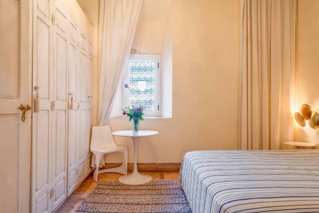 Postel nebo postele na pokoji v ubytování Maison Du Tresor