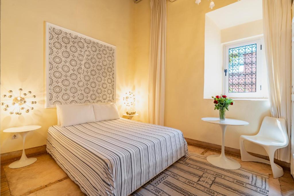 Postel nebo postele na pokoji v ubytování Maison Du Tresor