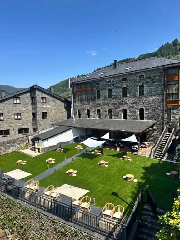 a large building with a lawn in front of it at Aguas de Ibias in Cecos